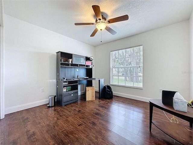 238 Sunridge Woods Blvd, Davenport, FL 33837 - office area with dark wood-type flooring, a ceiling fan, and a textured ceiling