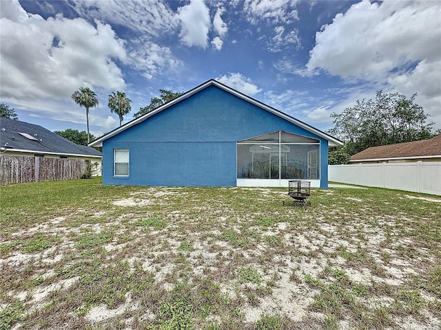 238 Sunridge Woods Blvd, Davenport, FL 33837 - back of house featuring a sunroom