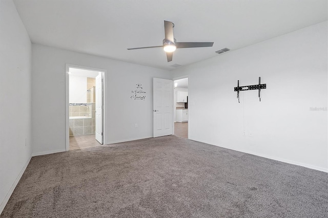 4505 Hummingbird Ln, Haines City, FL 33844 - unfurnished bedroom with carpet flooring, ceiling fan, and connected bathroom
