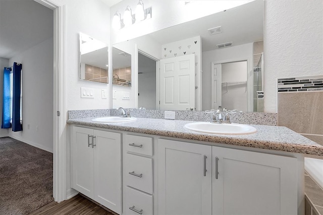 4505 Hummingbird Ln, Haines City, FL 33844 - full bath featuring double vanity, a shower, and a spacious closet