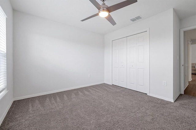 4505 Hummingbird Ln, Haines City, FL 33844 - unfurnished bedroom featuring carpet floors, a closet, and ceiling fan