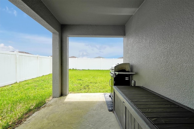 4505 Hummingbird Ln, Haines City, FL 33844 - fenced backyard featuring a patio and grilling area