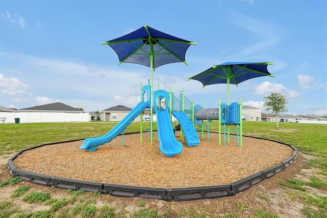 4505 Hummingbird Ln, Haines City, FL 33844 - community playground featuring a lawn