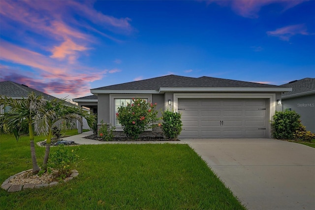4505 Hummingbird Ln, Haines City, FL 33844 - view of front of property featuring concrete driveway, an attached garage, stucco siding, and a lawn