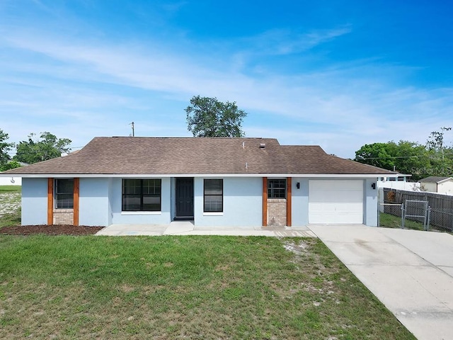 925 Roswell Ter, Deltona, FL 32738 - view of front facade with concrete driveway, stucco siding, and a garage