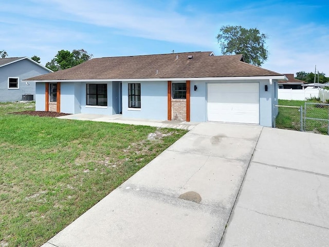 925 Roswell Ter, Deltona, FL 32738 - view of front of home with concrete driveway, an attached garage, a shingled roof, and stucco siding