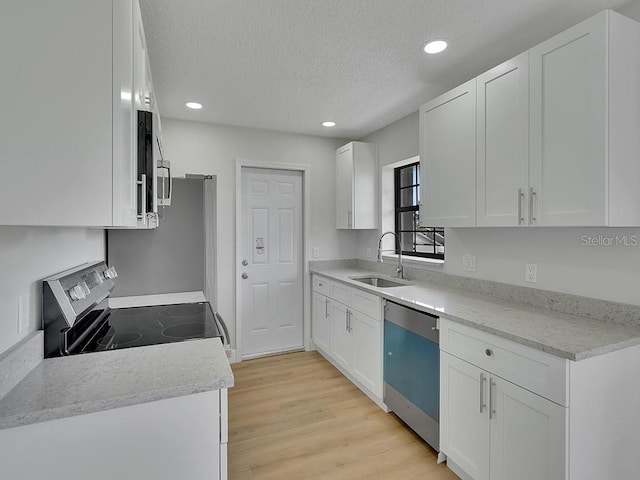 925 Roswell Ter, Deltona, FL 32738 - kitchen with appliances with stainless steel finishes, recessed lighting, white cabinets, light countertops, and a textured ceiling