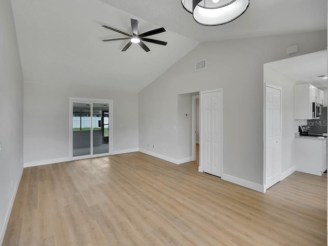 925 Roswell Ter, Deltona, FL 32738 - unfurnished living room with ceiling fan, light wood-type flooring, and high vaulted ceiling