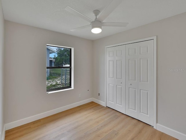 925 Roswell Ter, Deltona, FL 32738 - unfurnished bedroom with light wood finished floors, a closet, and a ceiling fan