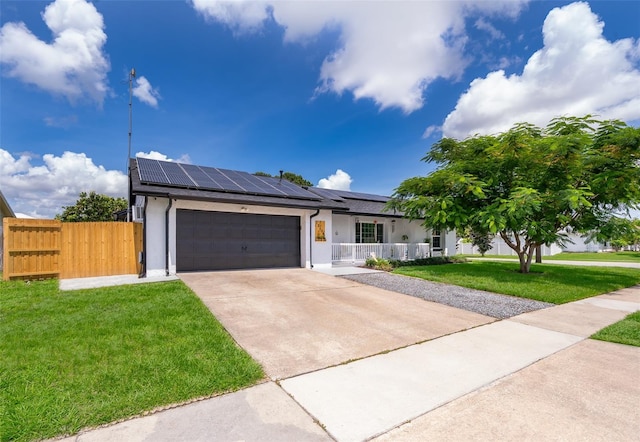 12104 Shallot St, Orlando, FL 32837 - ranch-style house featuring solar panels, stucco siding, driveway, and an attached garage