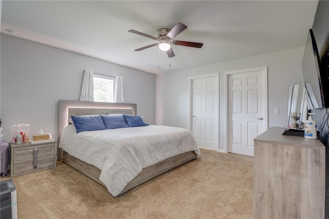 10 Pine Track Trl, Ocala, FL 34472 - bedroom with light colored carpet and ceiling fan
