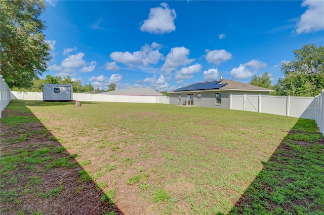 10 Pine Track Trl, Ocala, FL 34472 - fenced backyard with a storage unit
