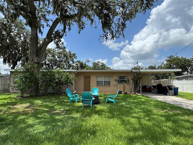 760 Bearcreek Dr, Bartow, FL 33830 - rear view of property featuring brick siding, an attached carport, and driveway