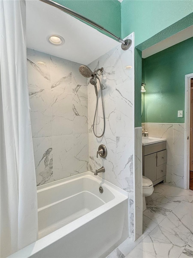 760 Bearcreek Dr, Bartow, FL 33830 - bathroom with tile walls, shower / bath combo, vanity, marble finish floors, and wainscoting