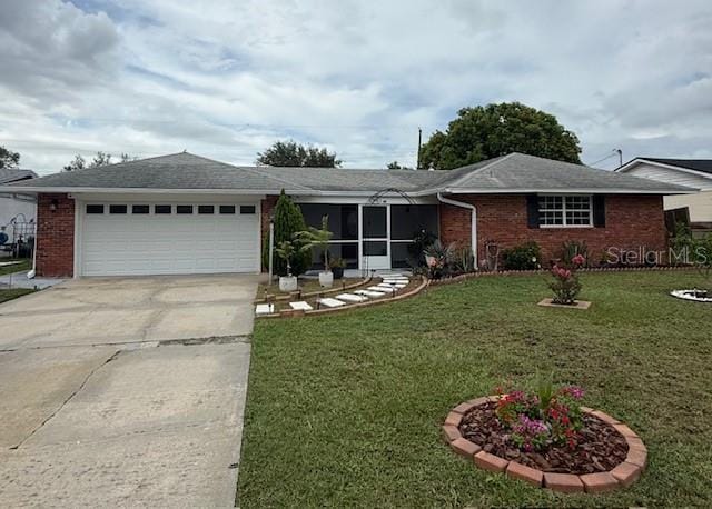 2013 Marilyn Ave, Winter Haven, FL 33881 - ranch-style home with driveway, brick siding, an attached garage, and a front lawn