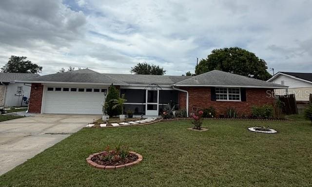 2013 Marilyn Ave, Winter Haven, FL 33881 - single story home with a garage, driveway, a front yard, brick siding, and a sunroom