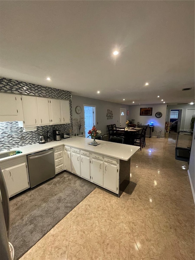 2013 Marilyn Ave, Winter Haven, FL 33881 - kitchen with dishwasher, recessed lighting, white cabinets, and light countertops