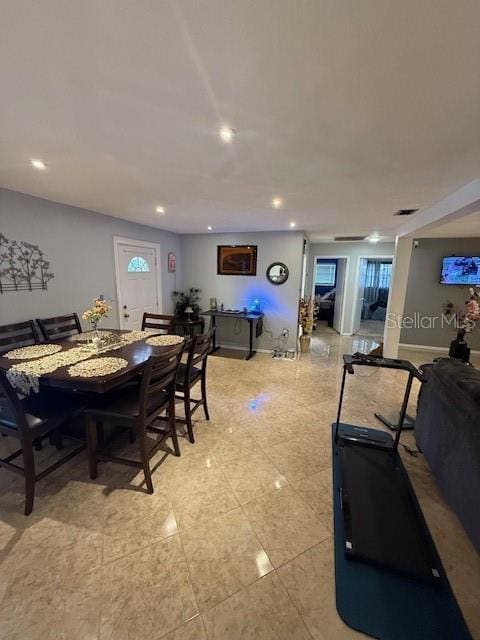2013 Marilyn Ave, Winter Haven, FL 33881 - dining room featuring light tile patterned flooring and recessed lighting