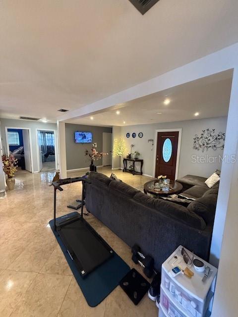 2013 Marilyn Ave, Winter Haven, FL 33881 - exercise area with recessed lighting and light tile patterned flooring