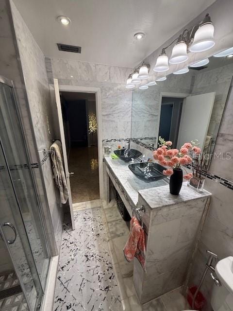 2013 Marilyn Ave, Winter Haven, FL 33881 - full bathroom featuring tile walls, a stall shower, double vanity, and recessed lighting