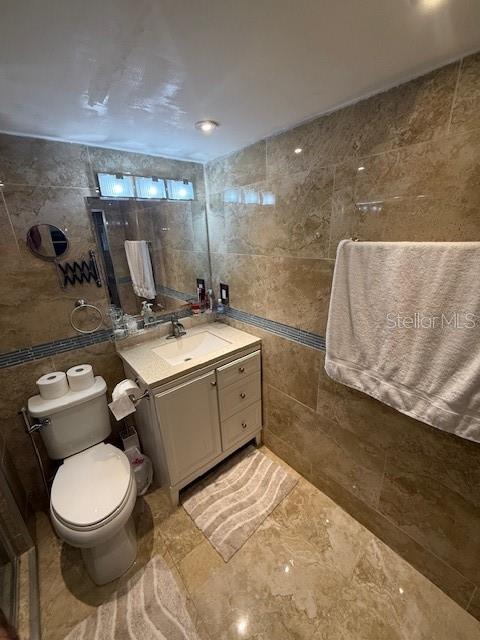 2013 Marilyn Ave, Winter Haven, FL 33881 - bathroom with tile walls and vanity