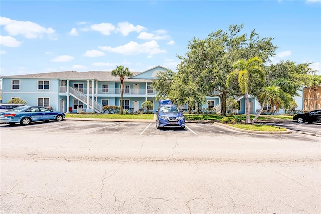 3111 Sun Lake Ct Unit B, Kissimmee, FL 34747 - view of building exterior with uncovered parking and stairs