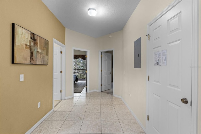 3111 Sun Lake Ct Unit B, Kissimmee, FL 34747 - corridor with electric panel, a textured ceiling, and light tile patterned floors