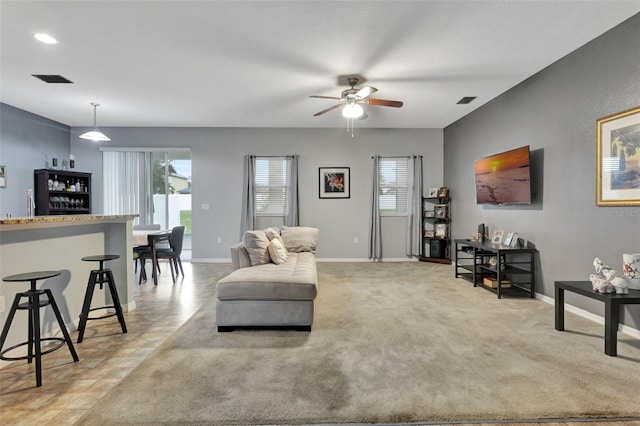 954 Revere Ave, Haines City, FL 33844 - living room featuring healthy amount of natural light, a ceiling fan, and bar