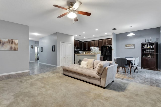954 Revere Ave, Haines City, FL 33844 - living area featuring a ceiling fan, light carpet, and recessed lighting