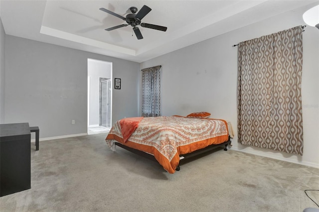 954 Revere Ave, Haines City, FL 33844 - carpeted bedroom with a tray ceiling and ceiling fan