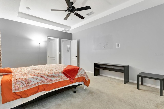 954 Revere Ave, Haines City, FL 33844 - bedroom with a tray ceiling, carpet flooring, and ceiling fan