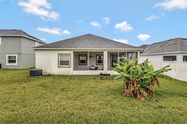 954 Revere Ave, Haines City, FL 33844 - rear view of property with a sunroom, roof with shingles, ceiling fan, and stucco siding