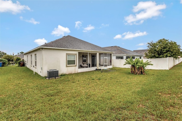 954 Revere Ave, Haines City, FL 33844 - back of property with a sunroom, stucco siding, and a shingled roof