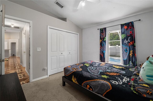 4428 Winding River Dr, Valrico, FL 33596 - carpeted bedroom featuring lofted ceiling, a closet, and ceiling fan