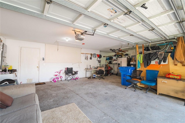 4428 Winding River Dr, Valrico, FL 33596 - garage featuring a garage door opener and stainless steel refrigerator with ice dispenser