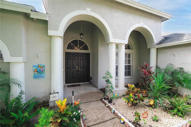 4428 Winding River Dr, Valrico, FL 33596 - doorway to property featuring stucco siding