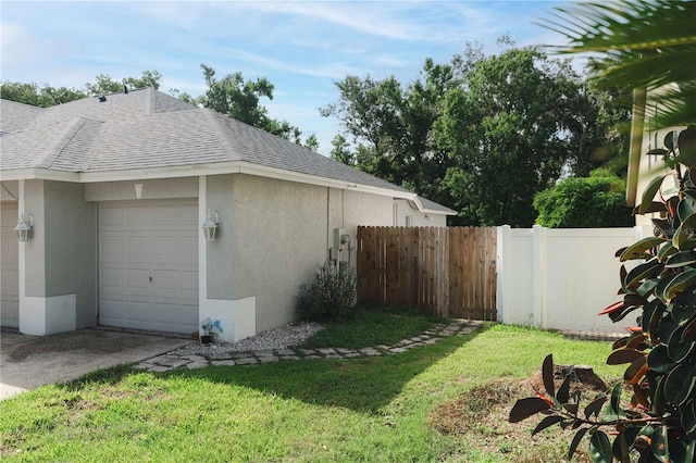 4428 Winding River Dr, Valrico, FL 33596 - view of side of property featuring a shingled roof, stucco siding, a garage, and concrete driveway