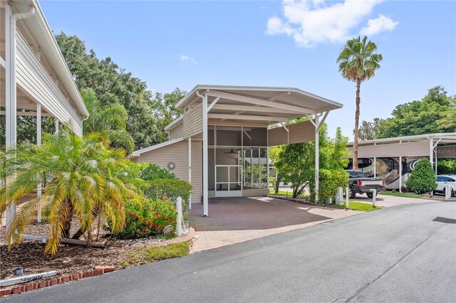 2343 St George Dr, Davenport, FL 33837 - view of vehicle parking with a carport