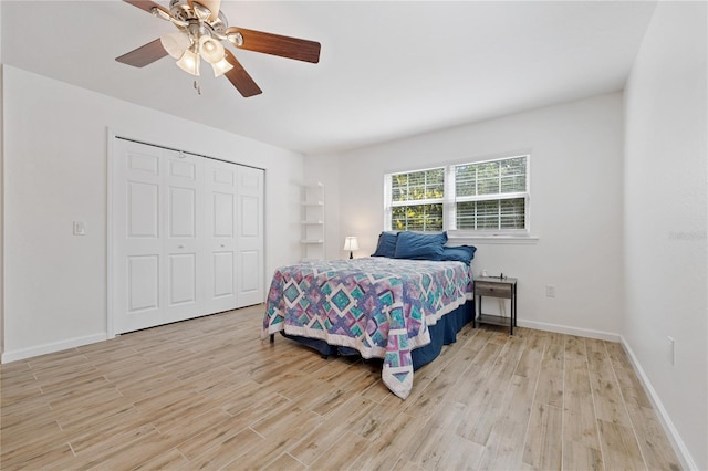 2343 St George Dr, Davenport, FL 33837 - bedroom featuring light wood finished floors, a closet, and a ceiling fan