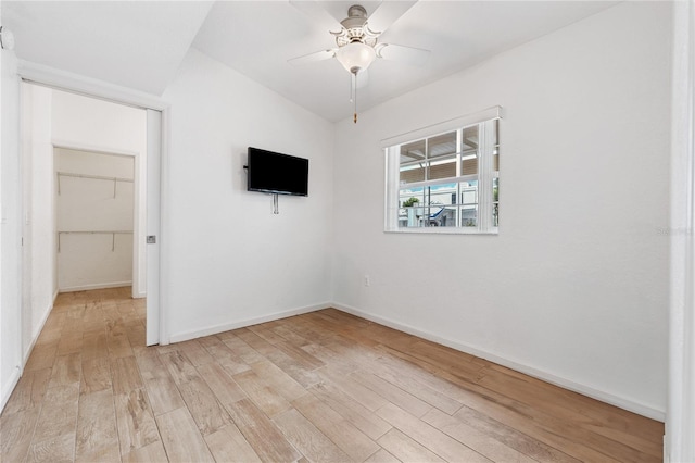 2343 St George Dr, Davenport, FL 33837 - empty room with light wood-style flooring and ceiling fan