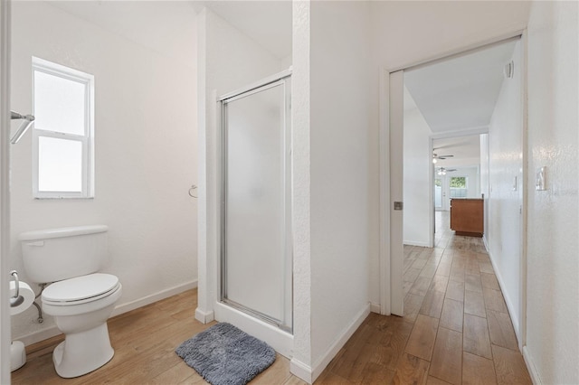 2343 St George Dr, Davenport, FL 33837 - bathroom with wood finished floors, a shower stall, and a ceiling fan