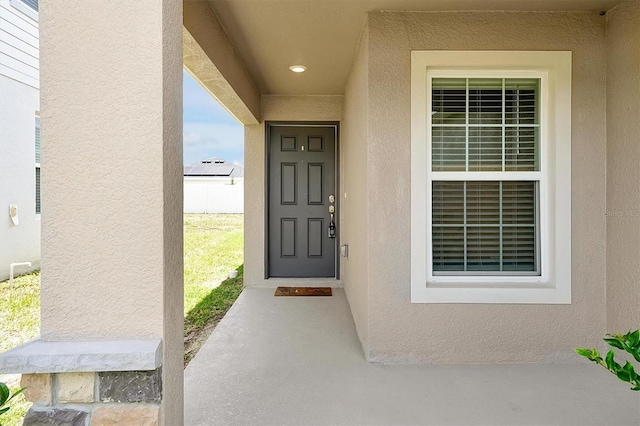 328 Lily Ln, Davenport, FL 33837 - property entrance with stucco siding