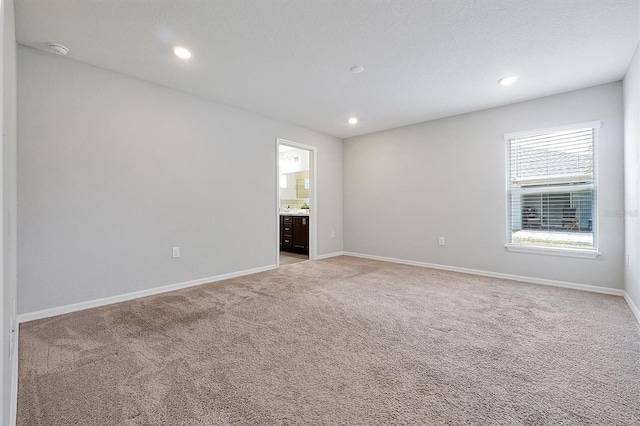 328 Lily Ln, Davenport, FL 33837 - unfurnished room with light colored carpet, a smoke detector, and recessed lighting