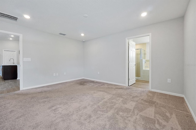 328 Lily Ln, Davenport, FL 33837 - carpeted empty room with baseboards and recessed lighting