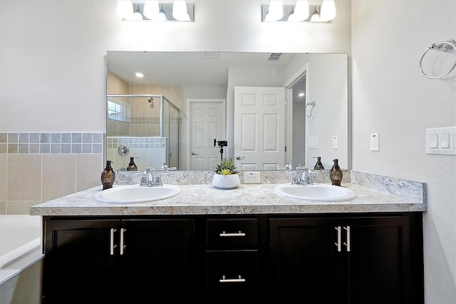 328 Lily Ln, Davenport, FL 33837 - full bath featuring double vanity, a stall shower, and a bathtub