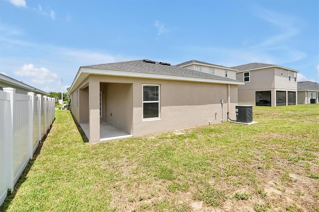 328 Lily Ln, Davenport, FL 33837 - back of property featuring a patio and stucco siding