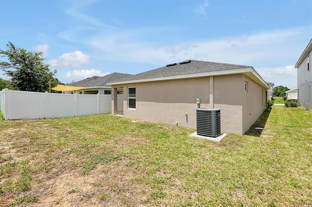 328 Lily Ln, Davenport, FL 33837 - back of house featuring stucco siding