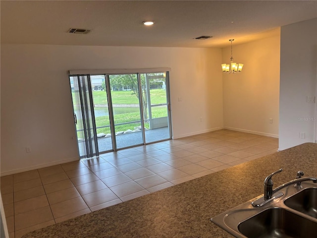 359 Arbor Lakes Dr, Davenport, FL 33896 - unfurnished room featuring a chandelier, light tile patterned floors, and recessed lighting