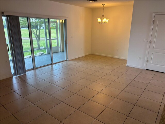 359 Arbor Lakes Dr, Davenport, FL 33896 - unfurnished room with a chandelier and light tile patterned flooring
