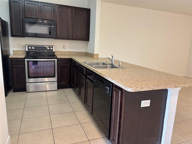 359 Arbor Lakes Dr, Davenport, FL 33896 - kitchen with black appliances, a peninsula, light tile patterned floors, and light countertops